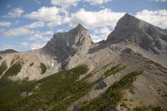 11 Two Of The Three Sisters - Charity Peak and Hope Peak From Just After Three Sisters Pass As Helicopter From Lake Magog Nears Canmore.jpg